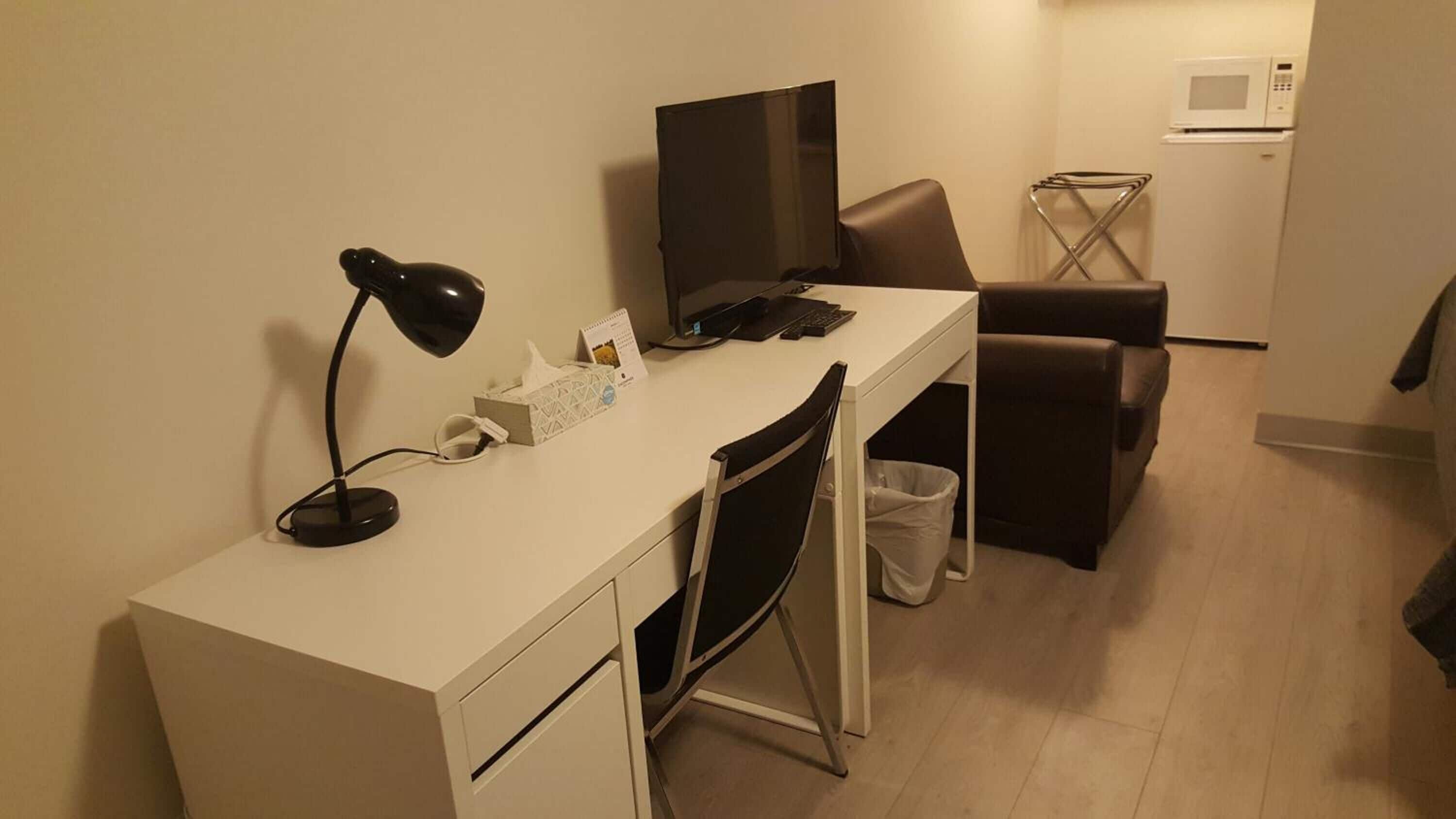 Desk, laptop workspace, free WiFi, bed sheets