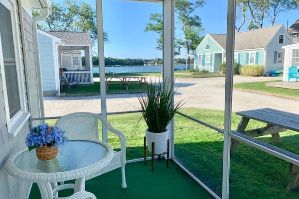 Screened-in porch with view of Bass River