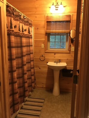 Combined shower/bathtub, towels, toilet paper