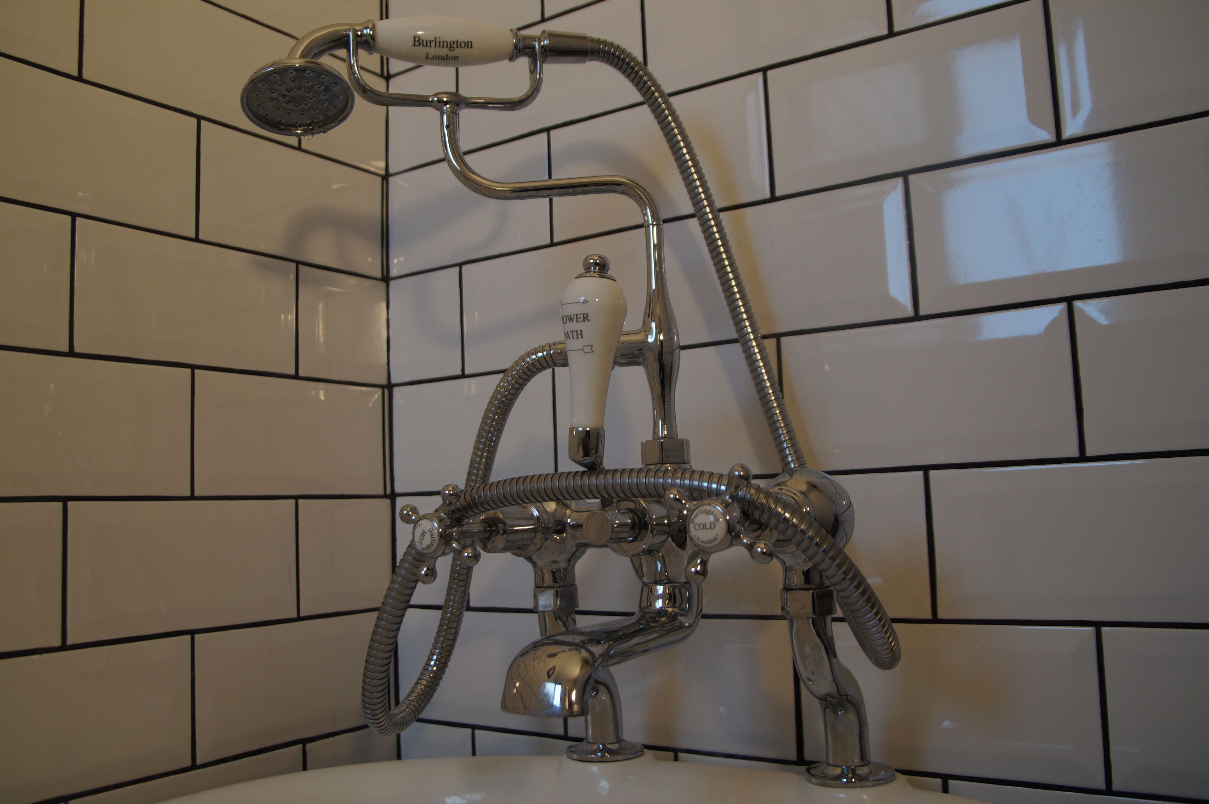 Bathtub, hair dryer, towels, soap