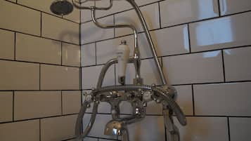 Bathtub, hair dryer, towels, soap