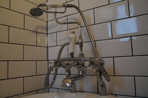 Bathtub, hair dryer, towels, soap
