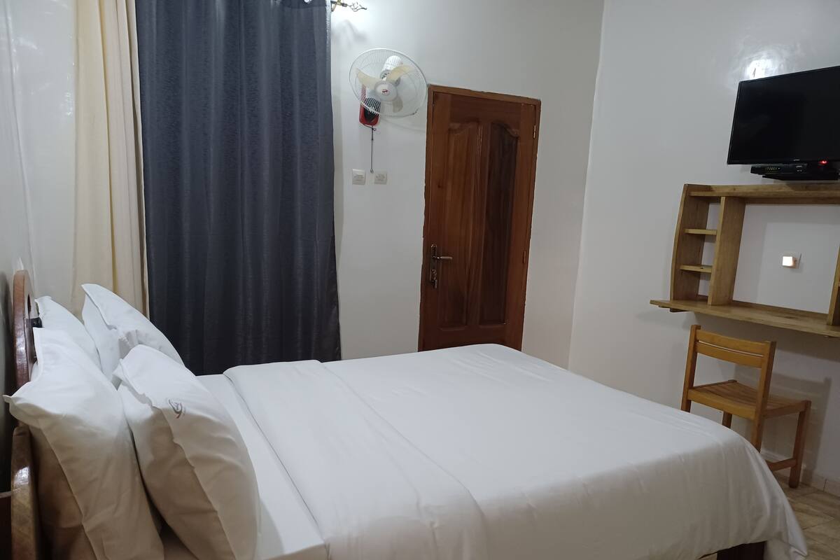 Desk, laptop workspace, blackout curtains, free WiFi