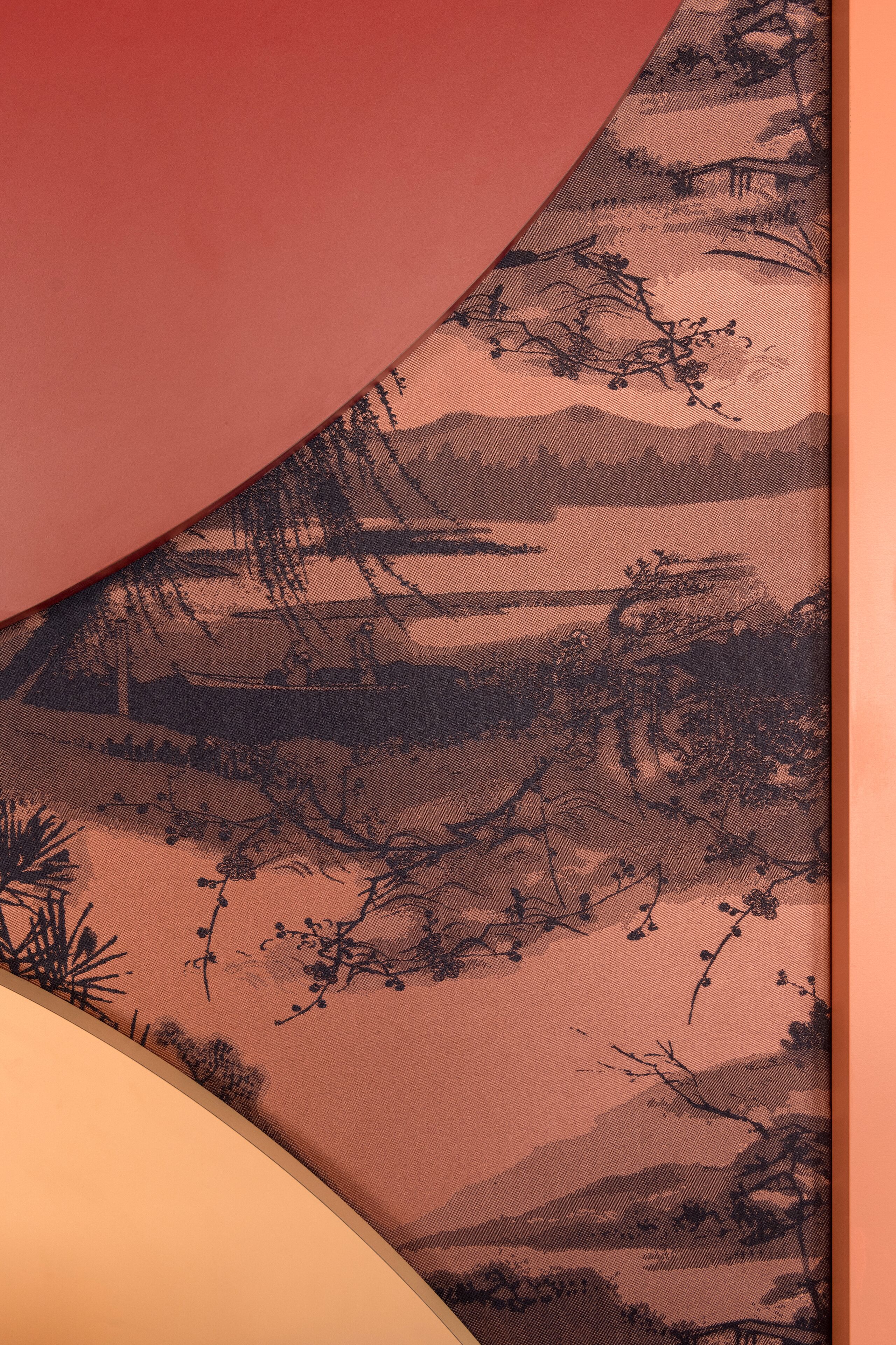 A fabric with a landscape pattern, possibly a tablecloth or upholstery.