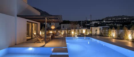 Seasonal outdoor pool, pool umbrellas, pool loungers