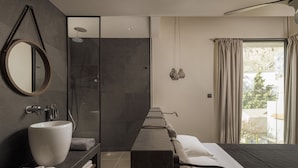 A modern bathroom with a large mirror, a round sink, and a shower. - Bianco Villa - Eve (Rhodes)
