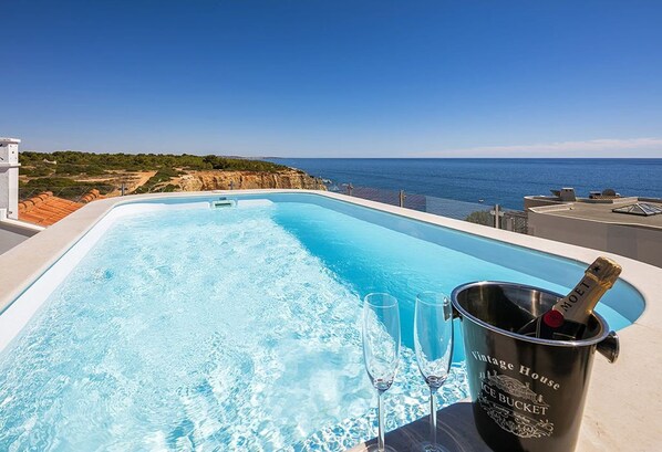A rooftop pool, a heated pool