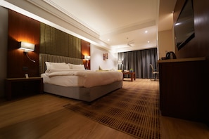 Super Deluxe | Living area | LED TV, fireplace, music library - Babylon Capital (Raipur)