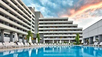 Indoor pool, outdoor pool, pool umbrellas, sun loungers