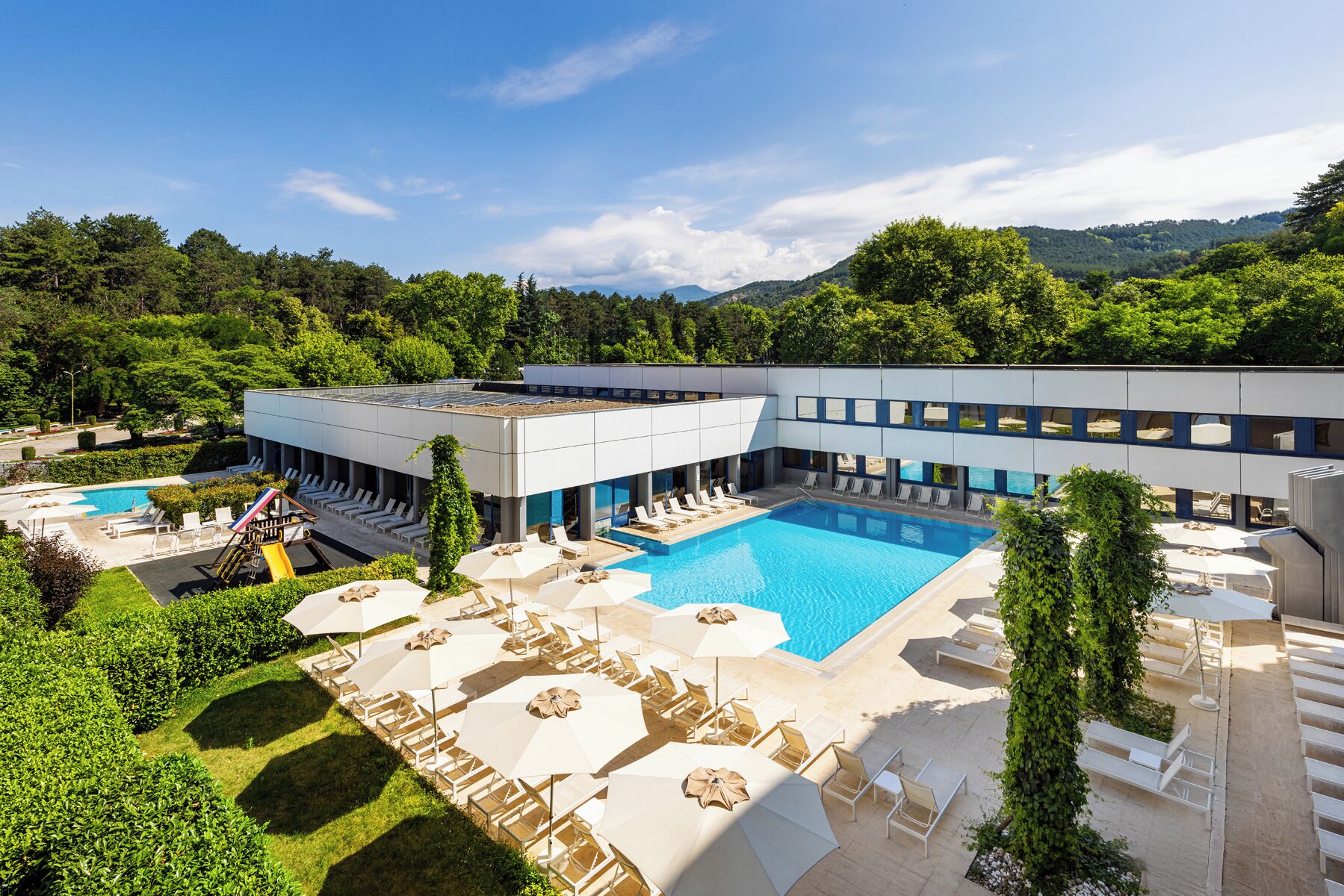 Indoor pool, outdoor pool, pool umbrellas, pool loungers