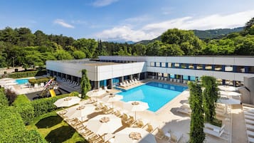 Indoor pool, outdoor pool, pool umbrellas, pool loungers