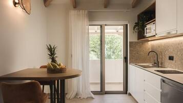 Superior Suite, 1 Bedroom, Sea View | Private kitchen | Full-sized fridge, microwave, stovetop, coffee/tea maker