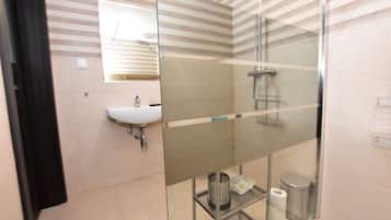 Shower, rainfall showerhead, hair dryer, towels