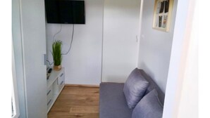 Apartment, Garden View | Living area | Flat-screen TV - Apartment Rosemary (Medulin)