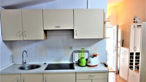 Apartment, Garden View | Private kitchen | Coffee/tea maker, full-size fridge, microwave, stovetop - Apartment Rosemary (Medulin)