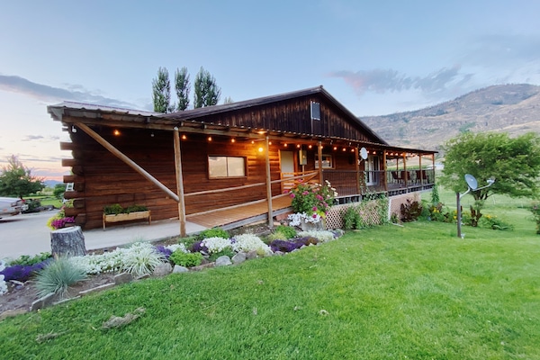 The side profile of the lodge where a handicapped accessible ramp is located.
