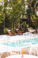 Outdoor pool, open 11:00 AM to 7:00 PM, pool umbrellas, sun loungers