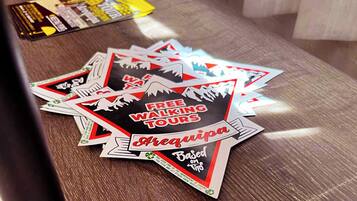 A table with various promotional materials, including flyers and brochures.