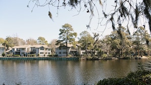 A lakeside view of a residential area with multiple houses. - Egret Point - Large 3BR/3BA - Great Location with Water View and Pool (Hilton Head Island)