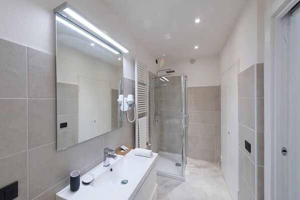 Shower, eco-friendly toiletries, hair dryer, bidet