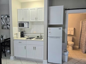 Fridge, microwave, stovetop, coffee/tea maker