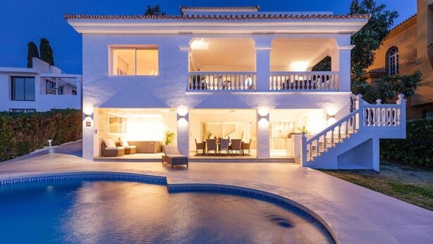 A two-story house with a swimming pool, a balcony, and a staircase. - Villa Alva | Luxe Heated Pool Cinema Sunset Views (Marbella)