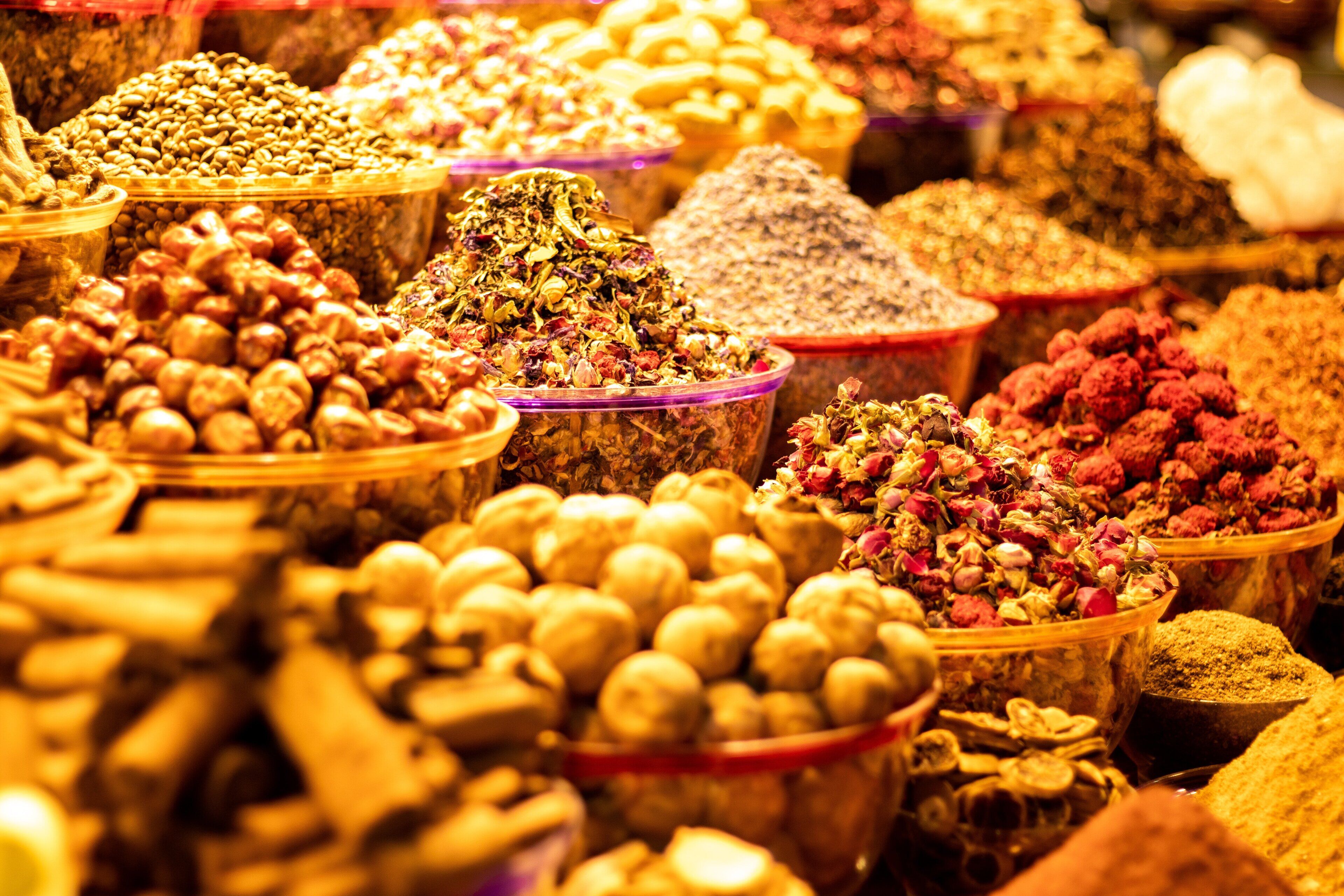 A variety of spices and herbs displayed in clear containers.