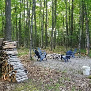 Property grounds - Beautiful log home with wrap-around deck surrounded by trees. (Egg Harbor)