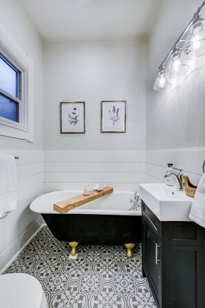Bathtub, hair dryer, towels, soap