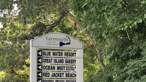 A sign listing local attractions including Blue Water Resort, Great Island Bakery, and Red Jacket Beach. - Breezy Vibes Cottage (3bd) ~ Backyard Blissful  ~ Walk to beaches (South Yarmouth)