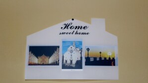 A house-shaped sign with the text "Home sweet home" and three pictures: a night scene with a building, a daytime church, and a sunset silhouette. - Stay in the heart of the historic center of Bari (Bari)