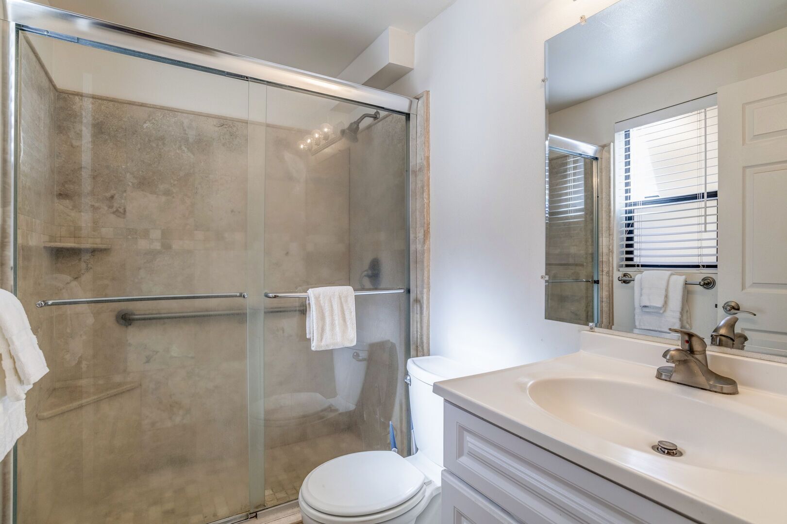 Combined shower/tub, hair dryer, towels, soap