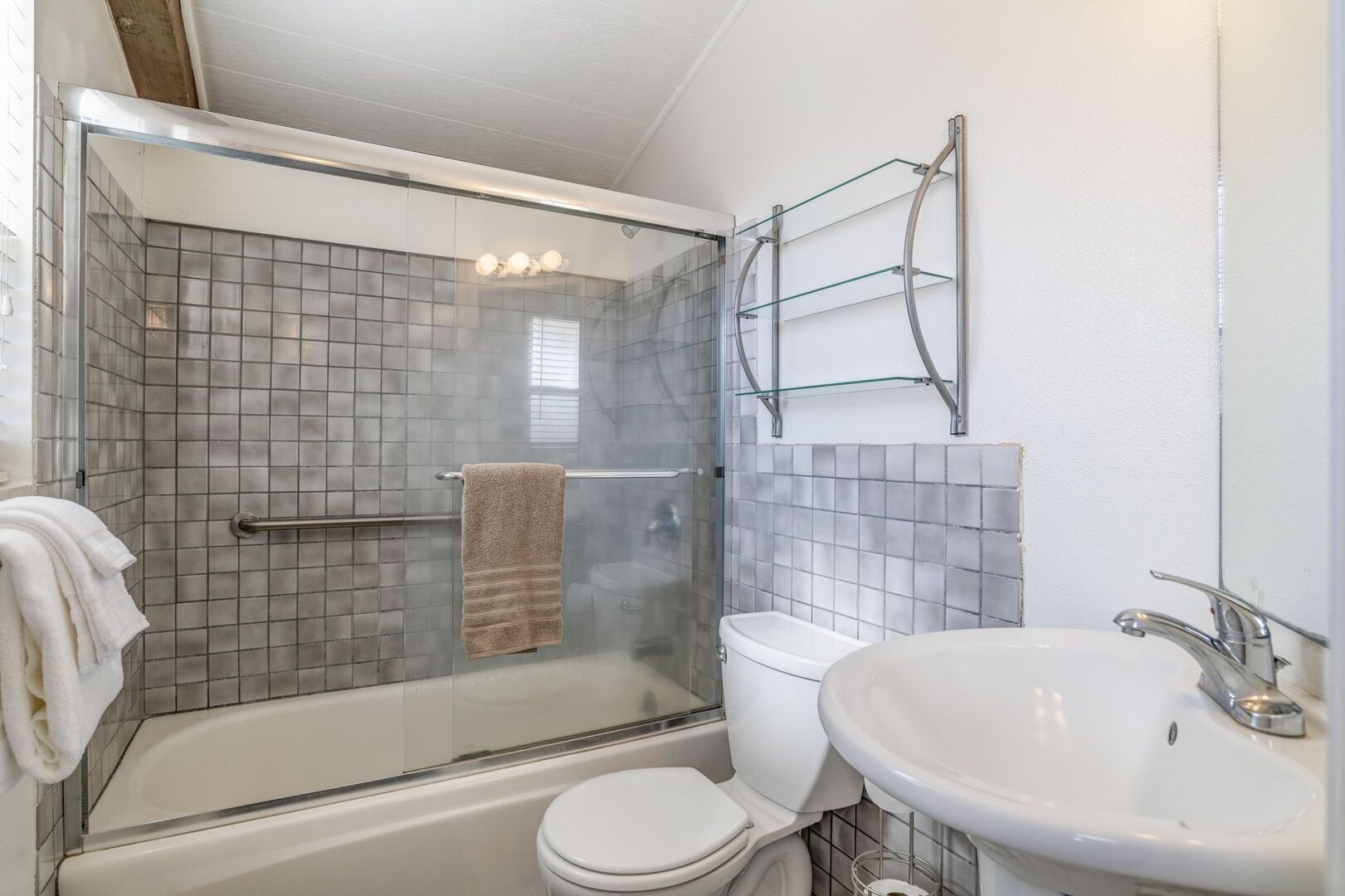 Combined shower/tub, hair dryer, towels, soap