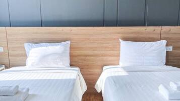 Hypo-allergenic bedding, desk, laptop workspace, blackout curtains