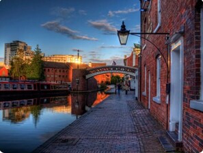 Stroll along the tranquil canal, taking in the historic architecture and cultural significance of this charming city center.