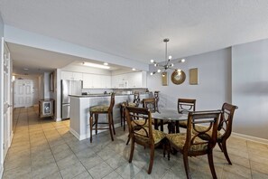 Enjoy meals in the kitchen and dining area with a central island, round table, and six comfortable chairs.
