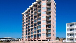 A multi-story hotel with balconies, located near a beach. - Fantastic views from this 1-bedroom oceanfront condo in Carolina Reef! | Carolina Reef -  105 (North Myrtle Beach)