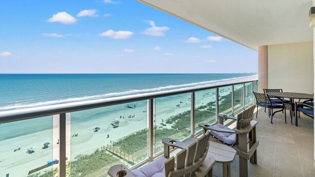 A balcony with a view of the beach and ocean. - The stunning view is king in this Crescent Keyes oceanfront condo! | Crescent Keyes - 1008 (North Myrtle Beach)