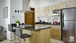 Deluxe Condo, Partial Ocean View | Private kitchen | Full-sized fridge, microwave, stovetop, cookware/dishes/utensils - Apartment With Roof Garden & Pool - L-6 (Mazatlán)