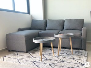 Loft Deluxe, vista a la ciudad | Sala de estar | Televisión de pantalla plana 