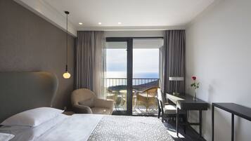 Double Room, Balcony, Sea View | Minibar, in-room safe, desk, laptop workspace