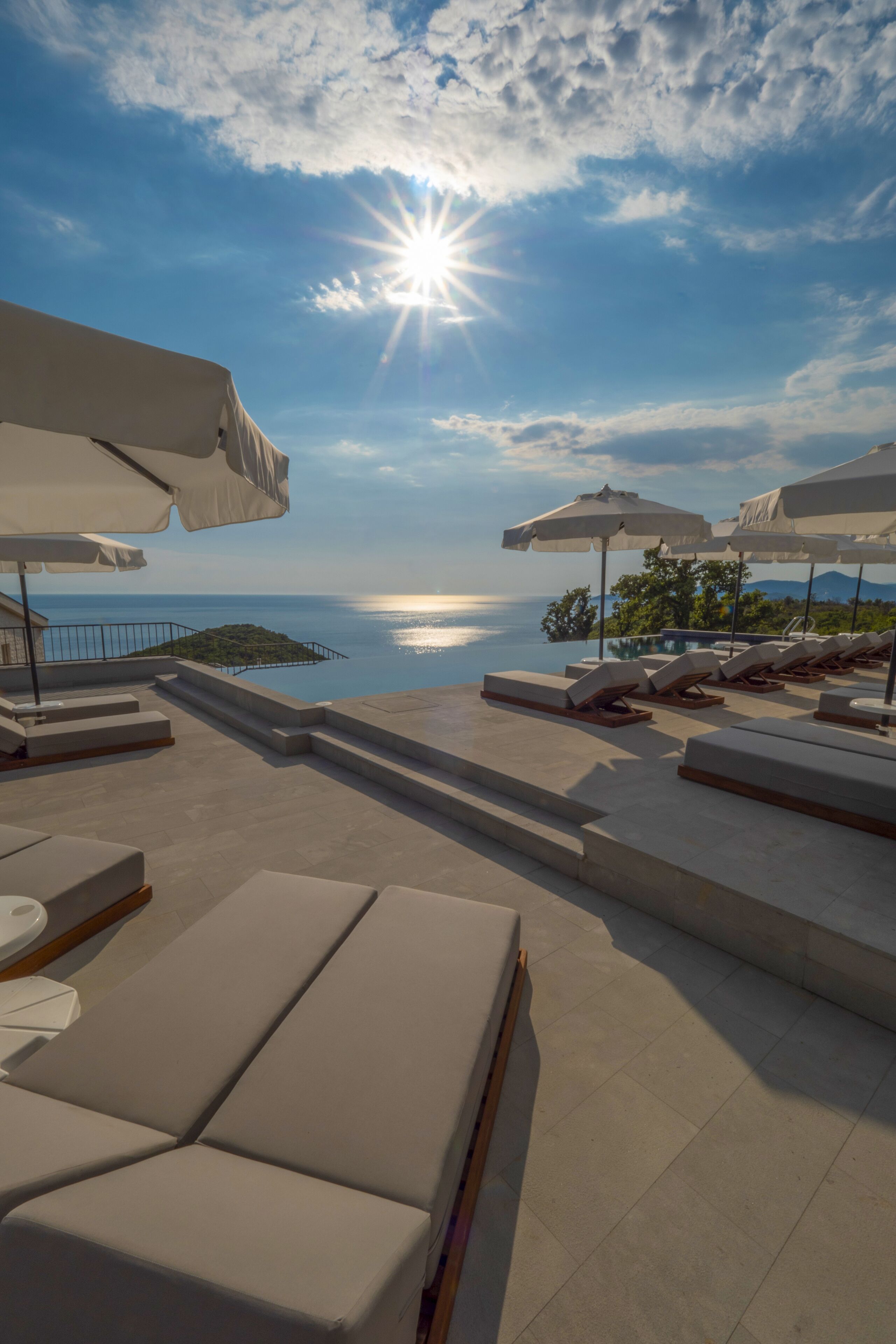 Seasonal outdoor pool, open 9:00 AM to 6:00 PM, pool umbrellas