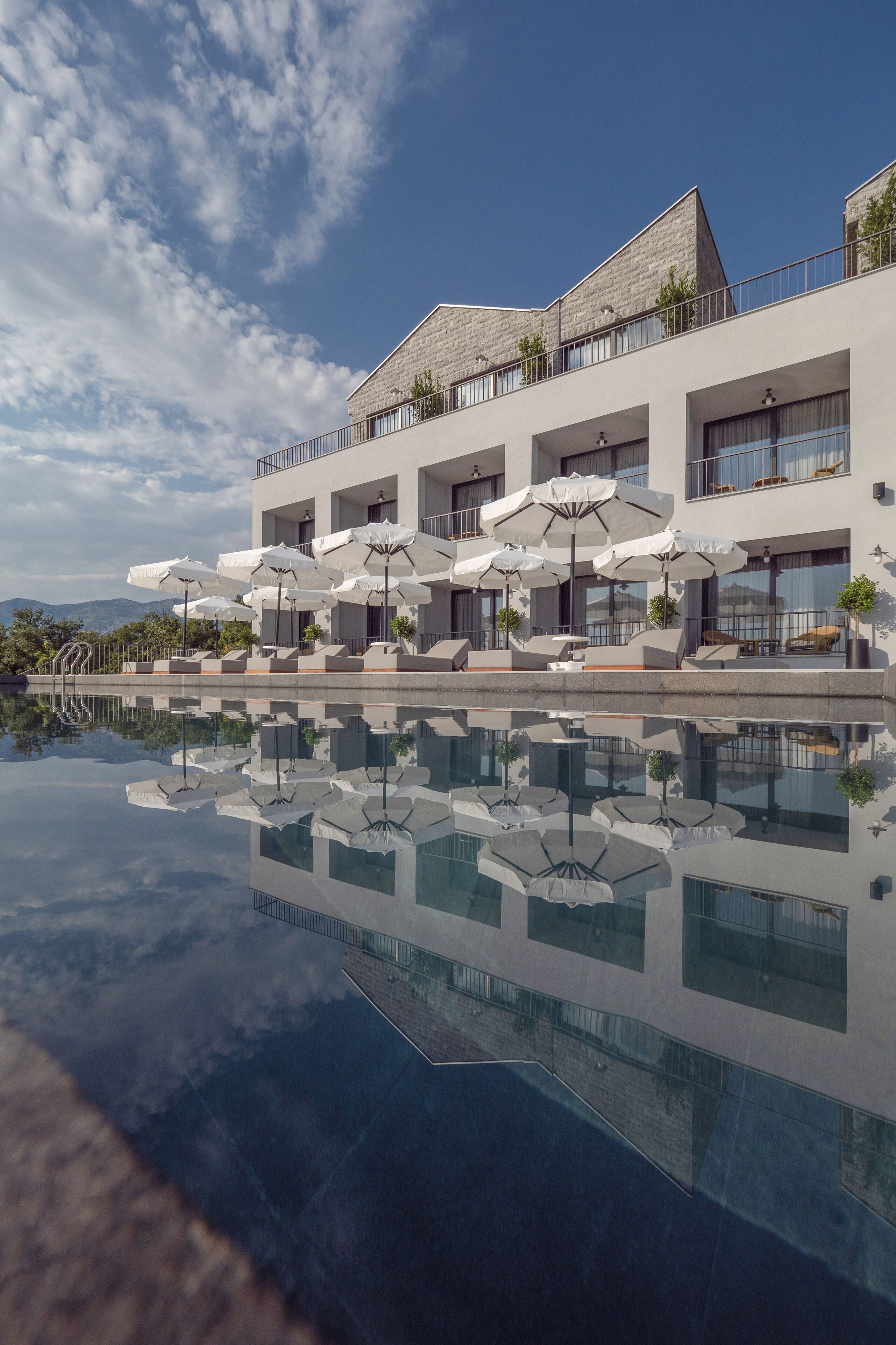 Seasonal outdoor pool, open 9:00 AM to 6:00 PM, pool umbrellas