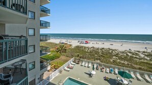 A hotel with a pool, beach view, and outdoor seating area. - Oceanfront 3-bedroom, 3-bathroom condo, jetted tub, private balcony | Ocean Bay Club - 308 (North Myrtle Beach)