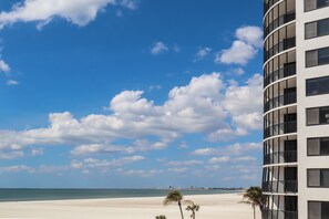 A beachfront hotel with a view of the ocean and a clear sky. - World Class Sunsets on the Gulf From Your Lanai! Beachfront 2B/2B Sandarac Vacation Condo (Fort Myers Beach)