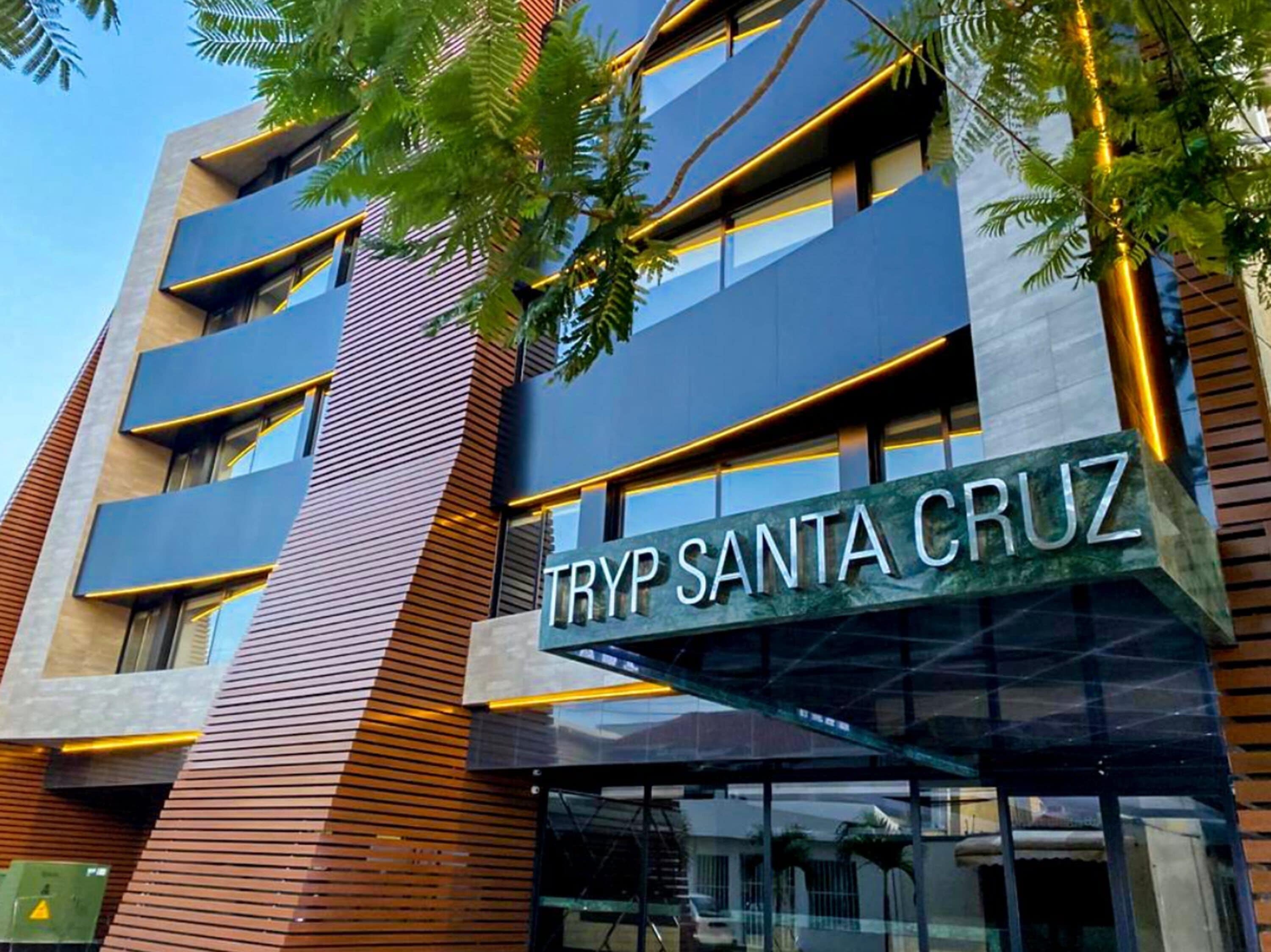 A modern building with a sign reading "TRYP SANTA CRUZ".