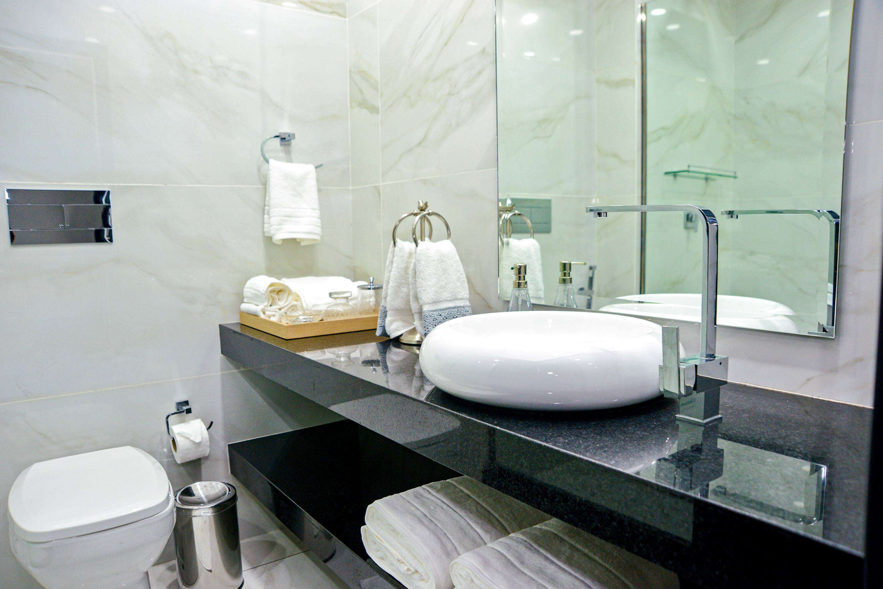 shower, rainfall showerhead, hair dryer, towels