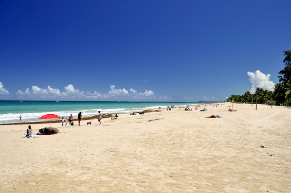 Enjoy a serene beach experience with access to the ocean and plenty of space to sunbathe and walk along the shore.