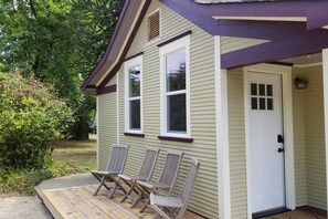 Charming single-story house with a cozy front porch and a welcoming entrance.