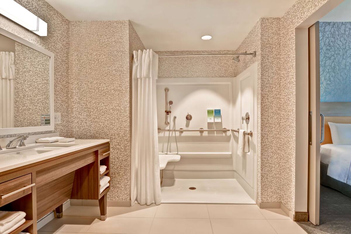 hair dryer, towels, soap, shampoo